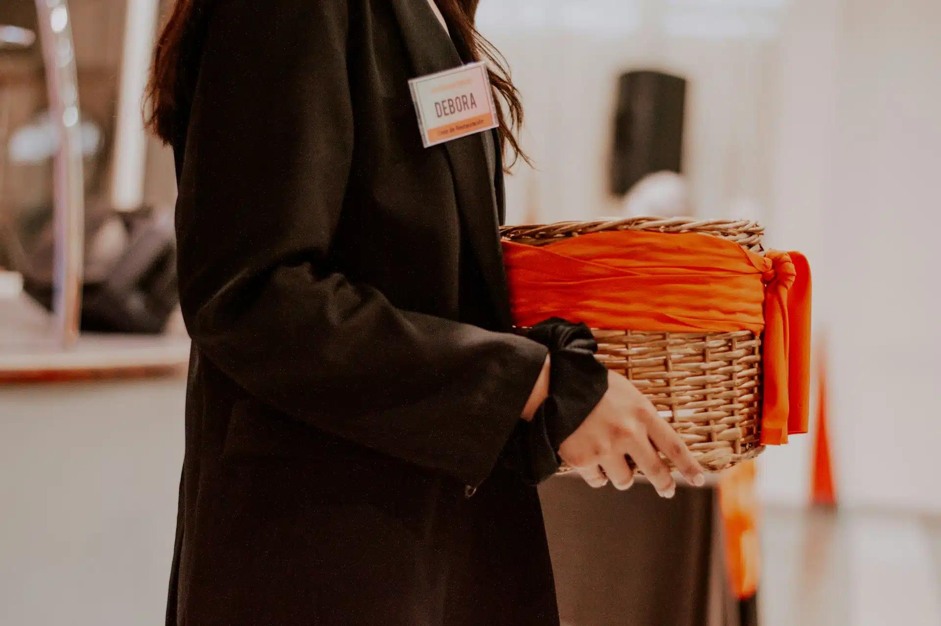 A woman carrying a gift basket