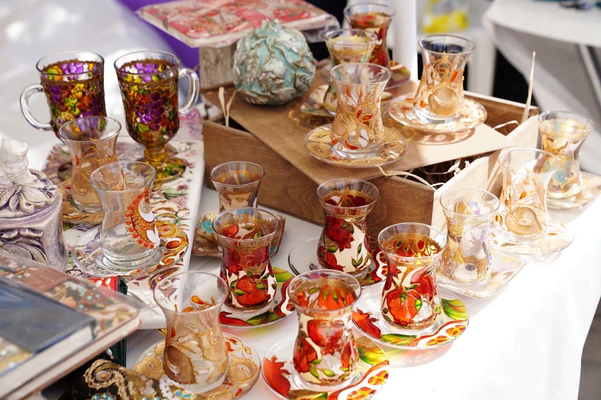 A collection of vibrant Azerbaijani hand-painted tea cups and saucers. Perfect depiction of cultural craftsmanship
