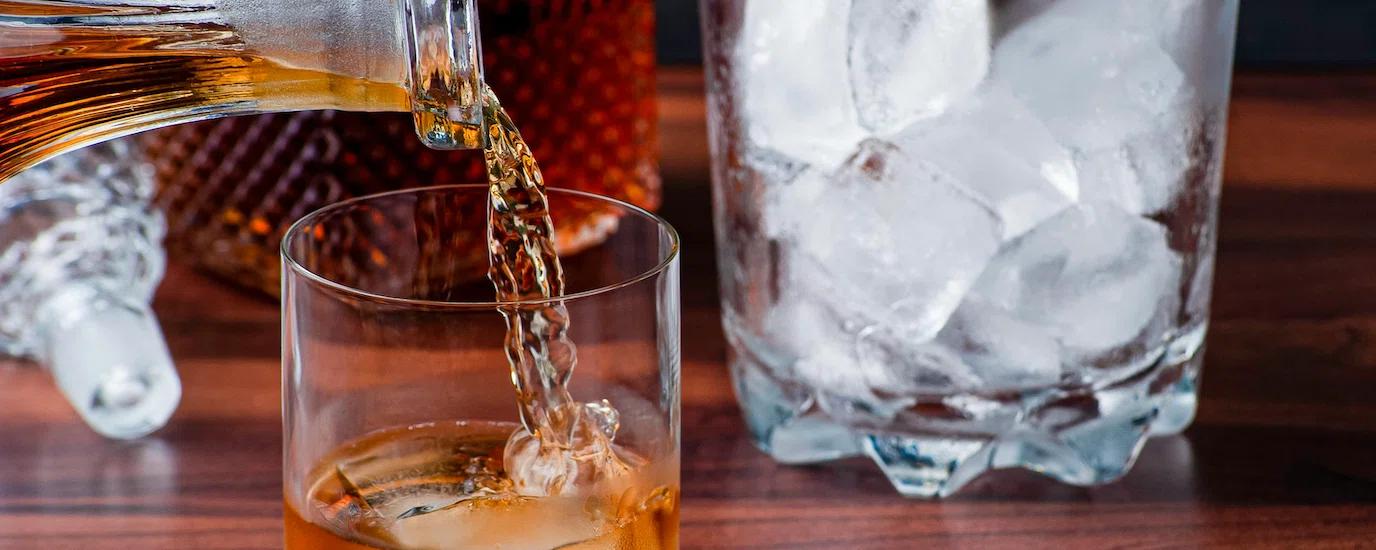 Pouring whiskey into a glass