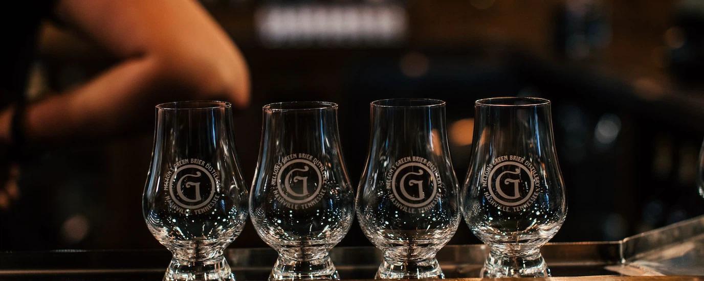 A lineup of engraved Glencairn whisky glasses