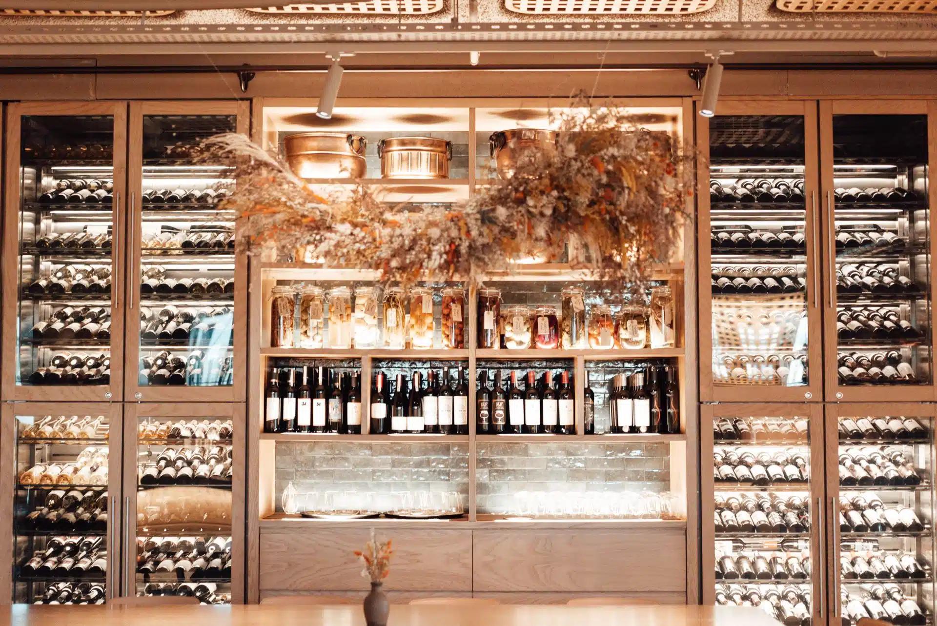 Stylish wine cellar showcasing an elegant collection of bottles in a modern setting, perfect for gourmet and luxury themes.