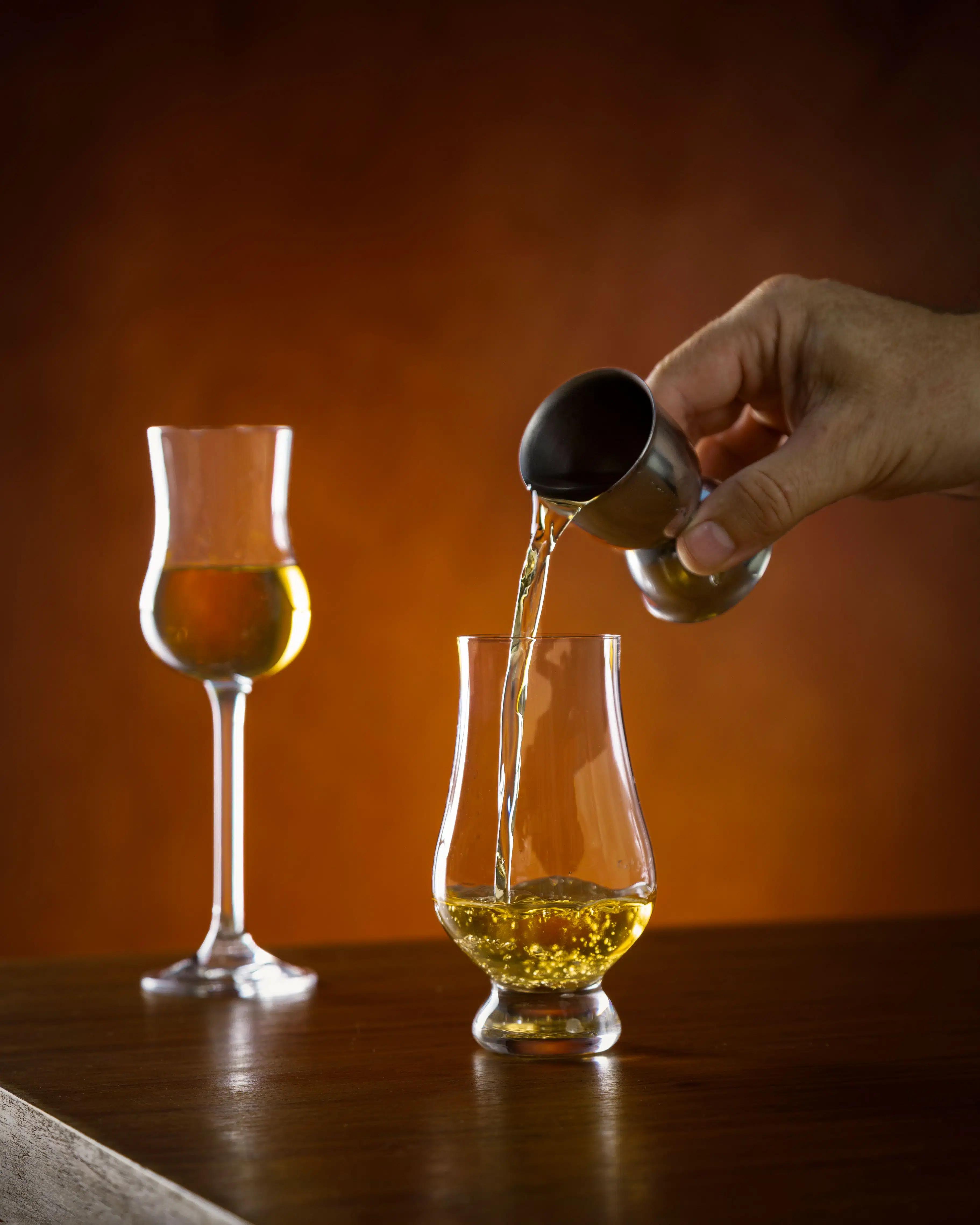 Pouring whiskey into a glass