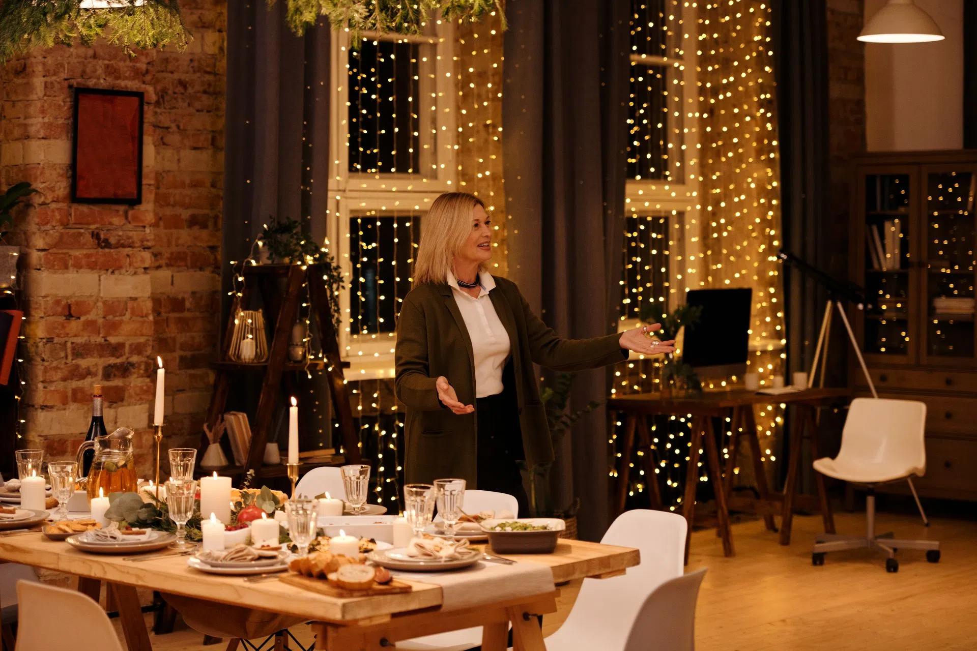 A cozy Christmas dinner setting with family gathering around a beautifully decorated table