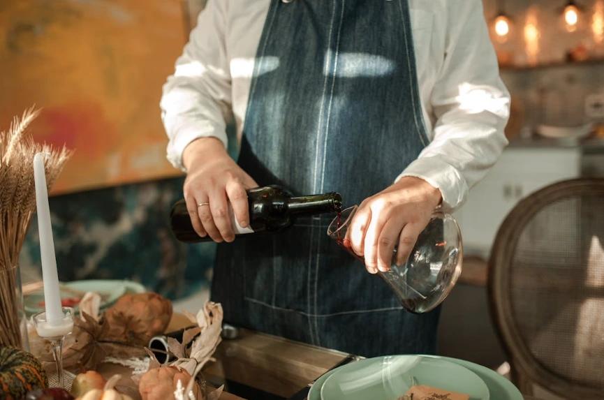 Pouring wine into a decanter