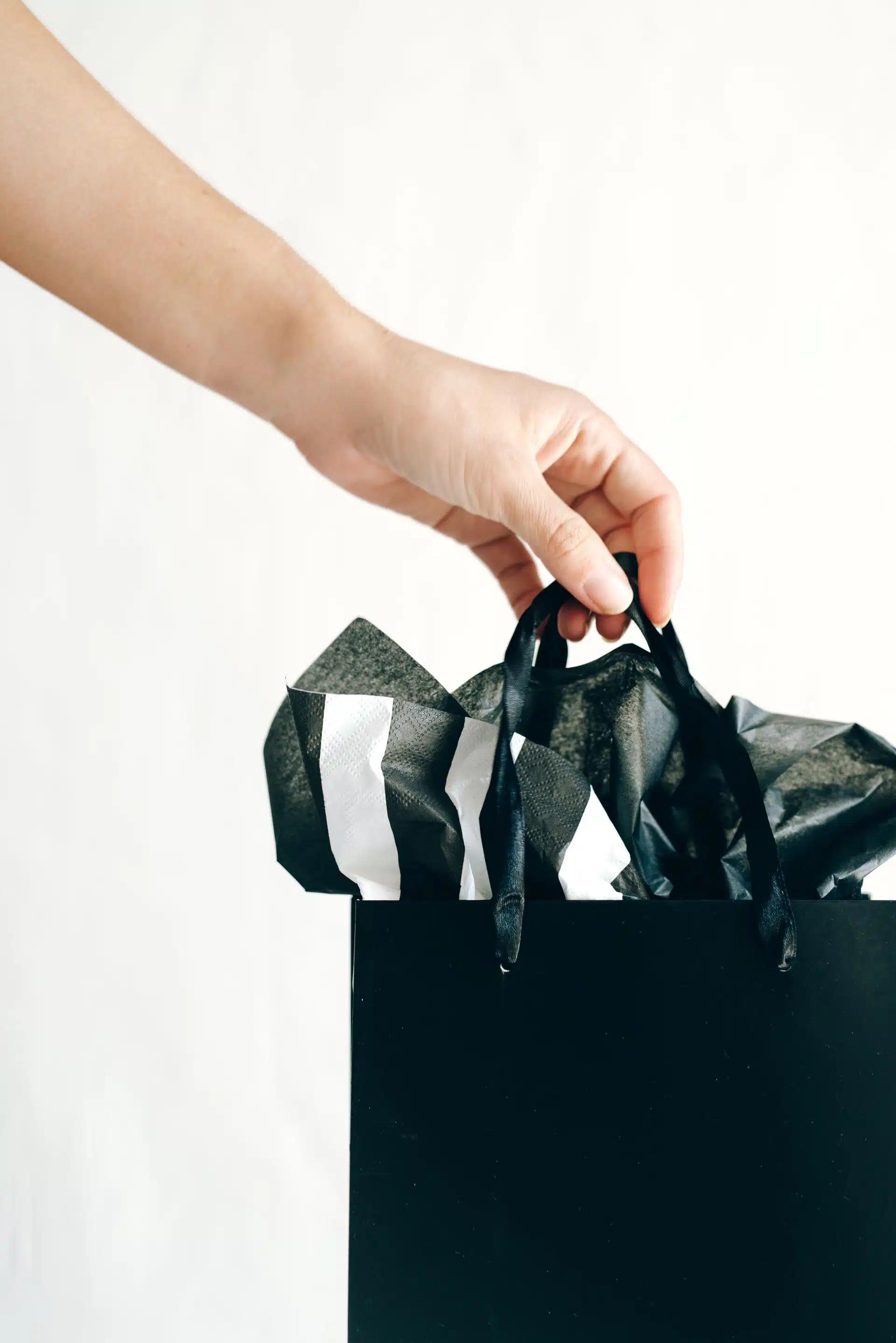 Hand carrying a gift bag