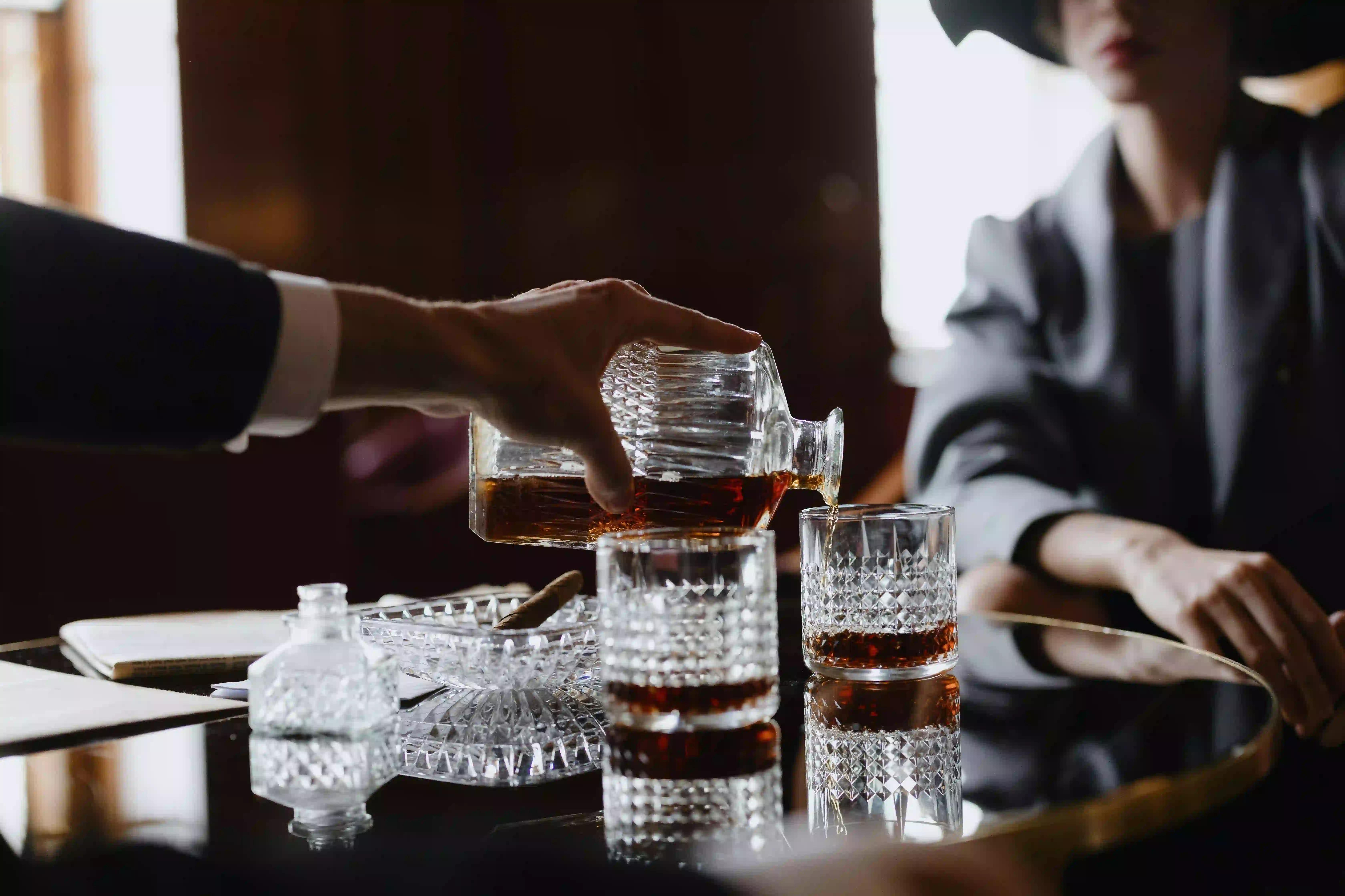 Pouring whiskey into a glass