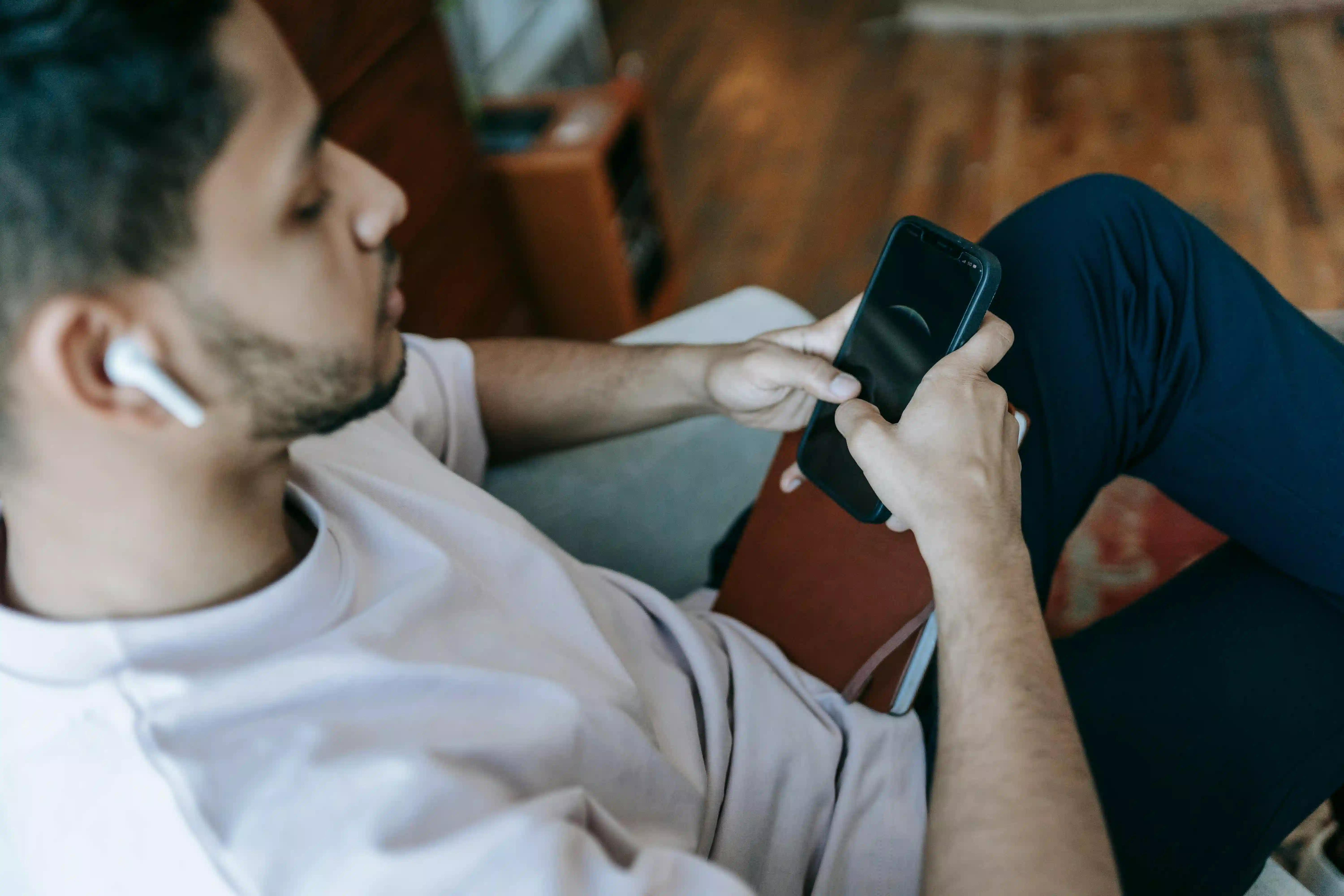 A man using his gadgets