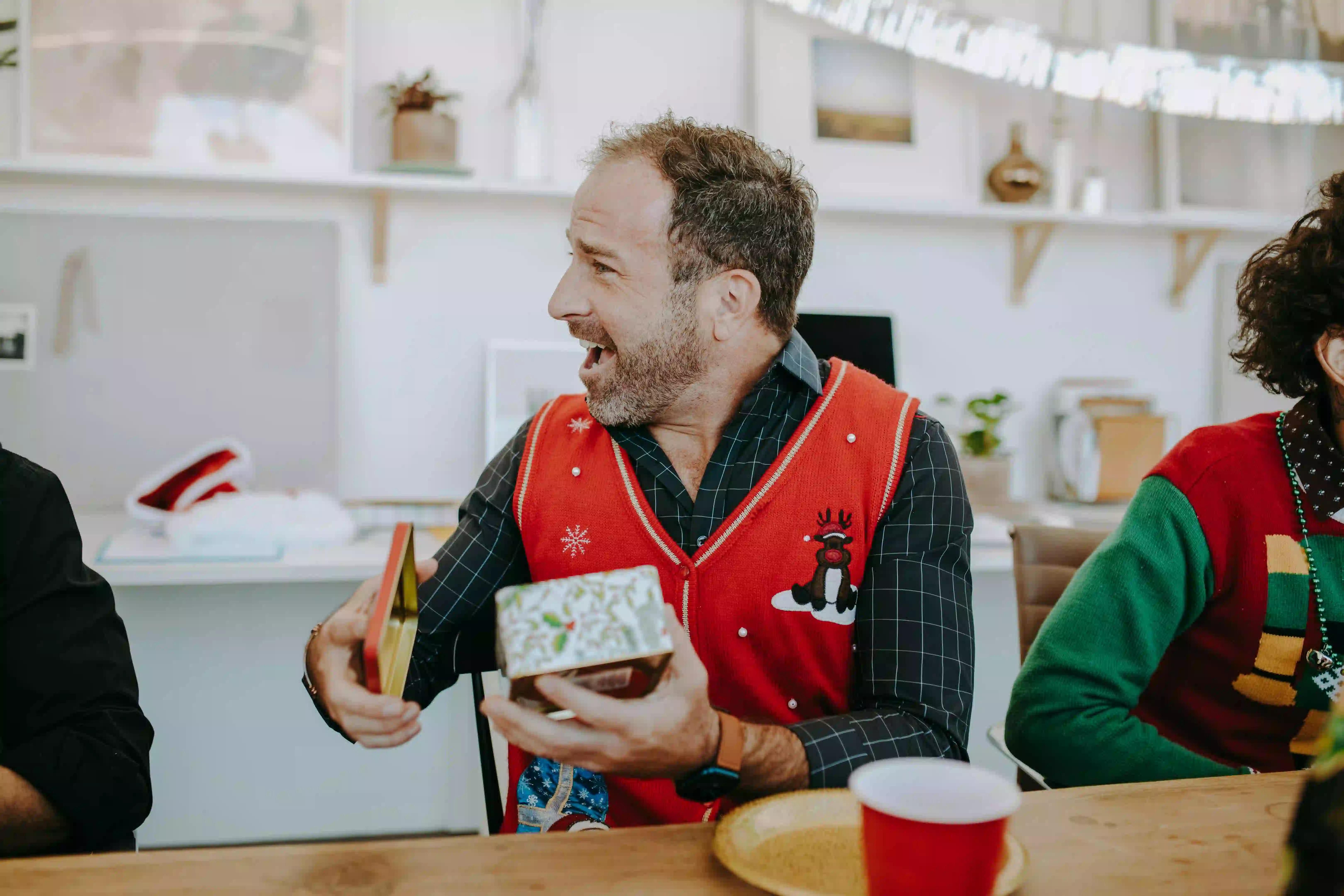 A boss opening a gift