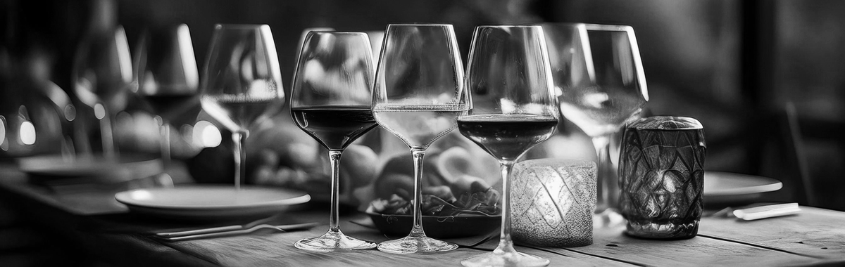 Set table with wine glasses and candles