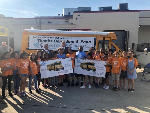Image Corradino and Papa School Bus Donation Group Class Photo