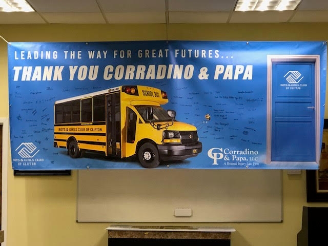 Image Corradino and Papa School Bus Donation Banner Photo