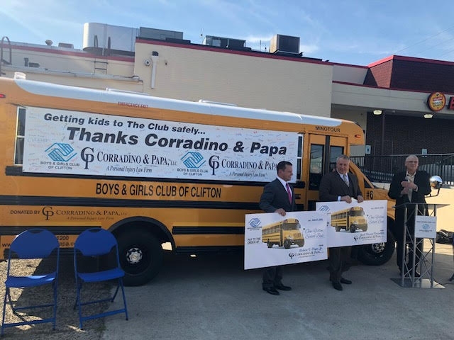 Image Corradino and Papa Checks School Bus Donation Group Photograph