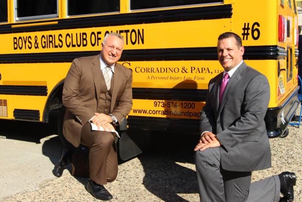 Image Corradino and Papa School Bus Donation Kneeling Group Photo