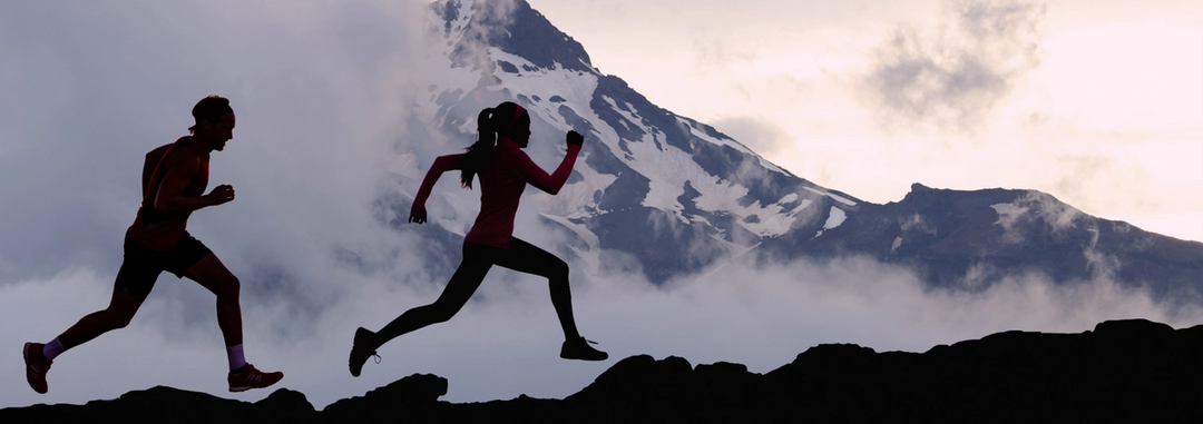 Healthy people jogging in the mountains.