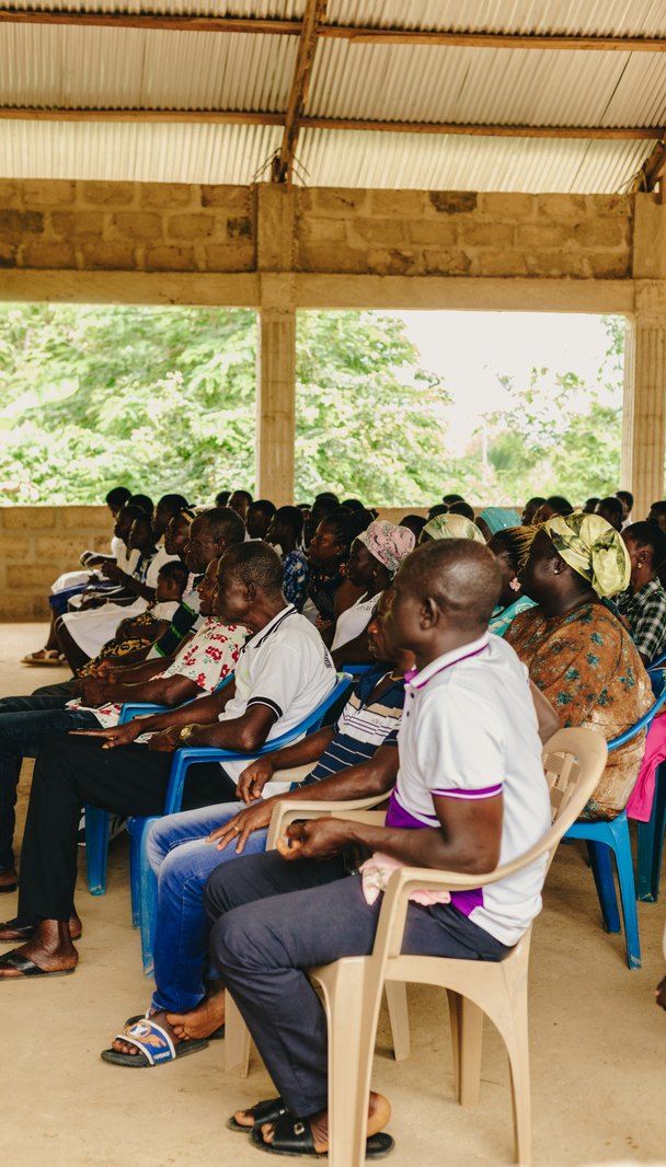 Community members seated together at the gathering