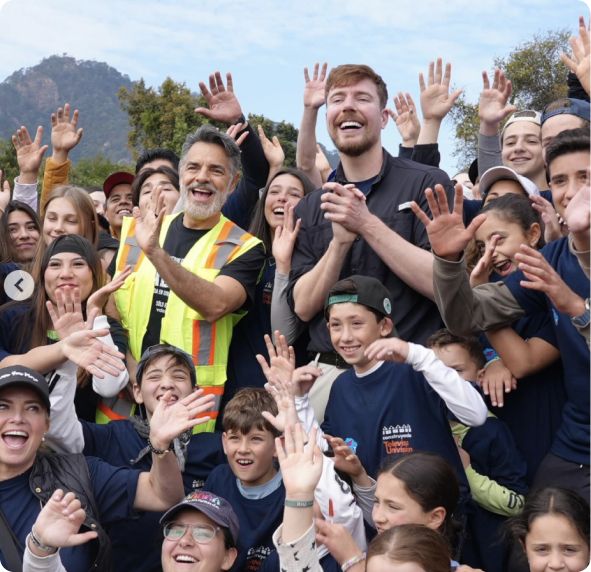 MrBeast with a crowd of the community the work serves