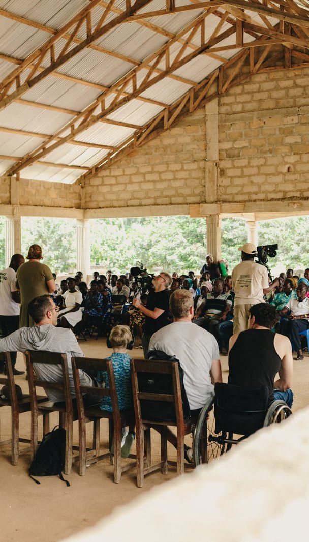 Parents and children listening during the meeting