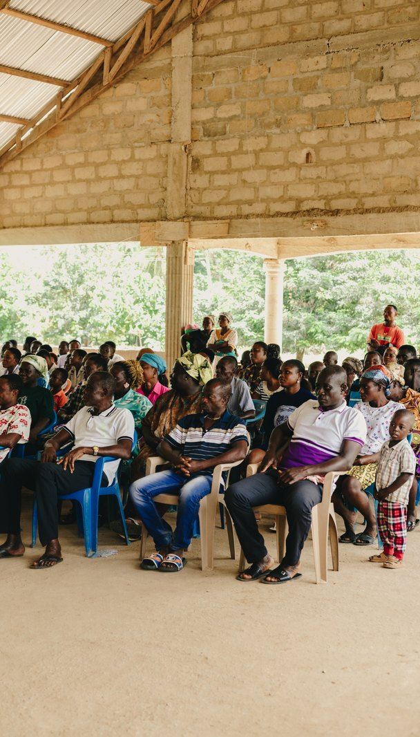 The community gathered under the open pavilion