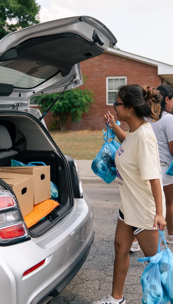 Groceries handed between volunteers