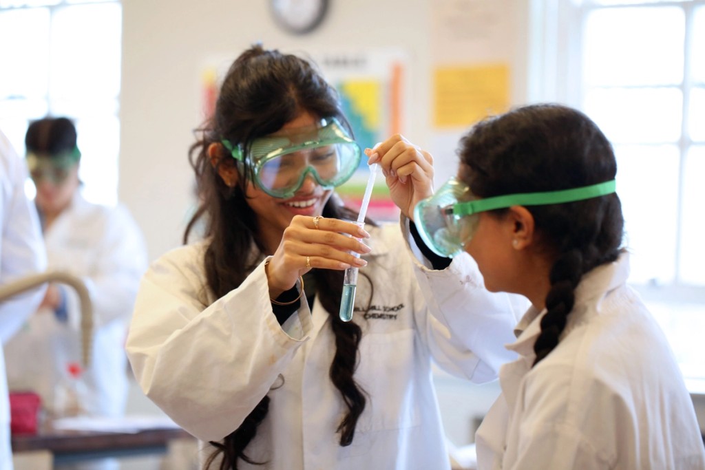 Science pupils doing an experiment 