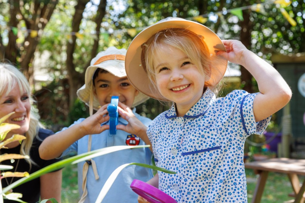 Small children in costumes, with a close up of one child