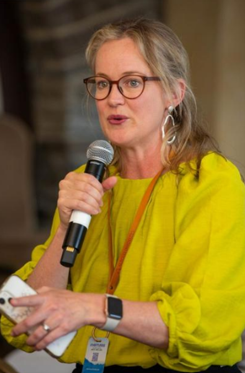 Jac speaking into a microphone