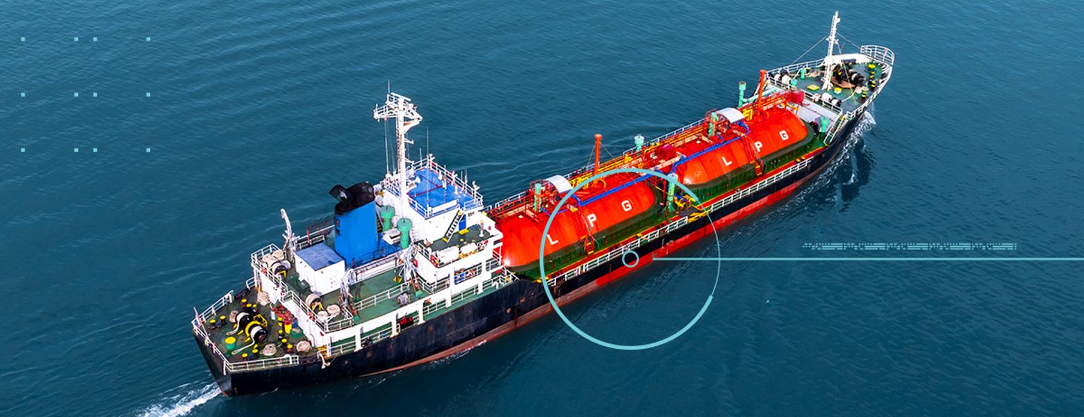 An aerial view of a liquid bulk tanker under way, with a tracking overlay