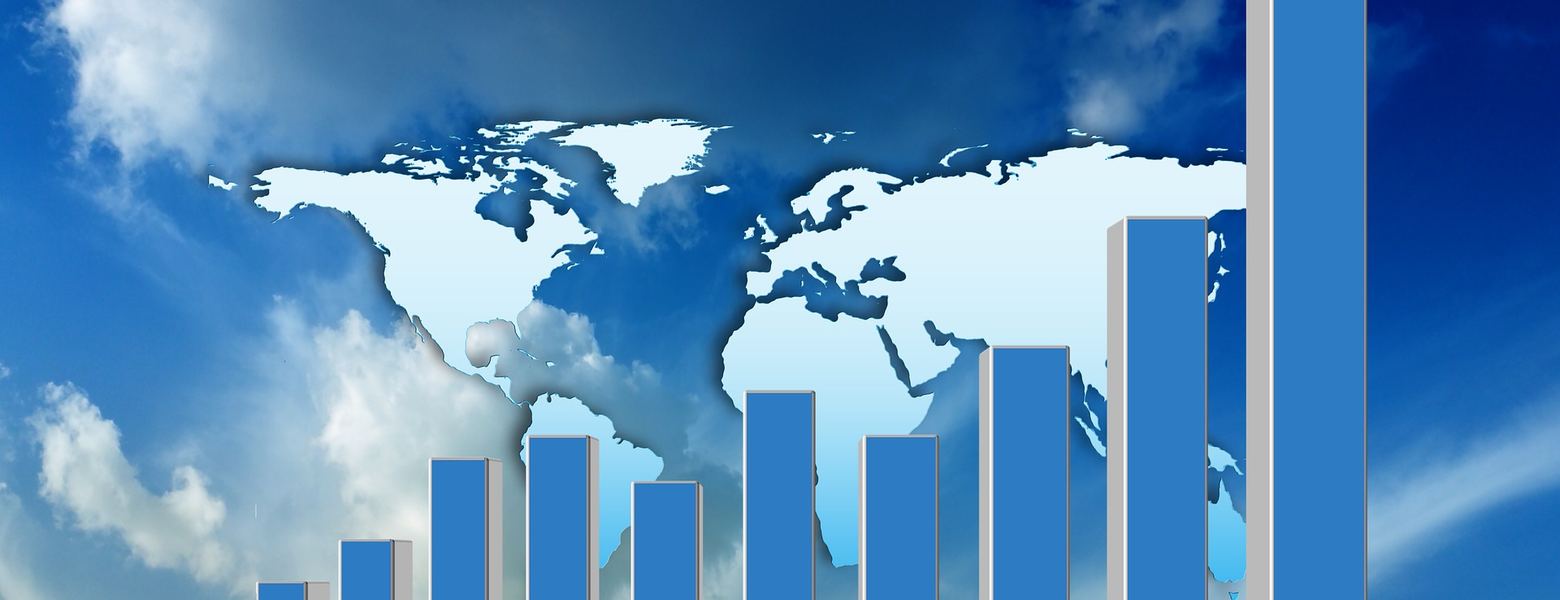 A rising bar chart over a world map against a cloudy sky