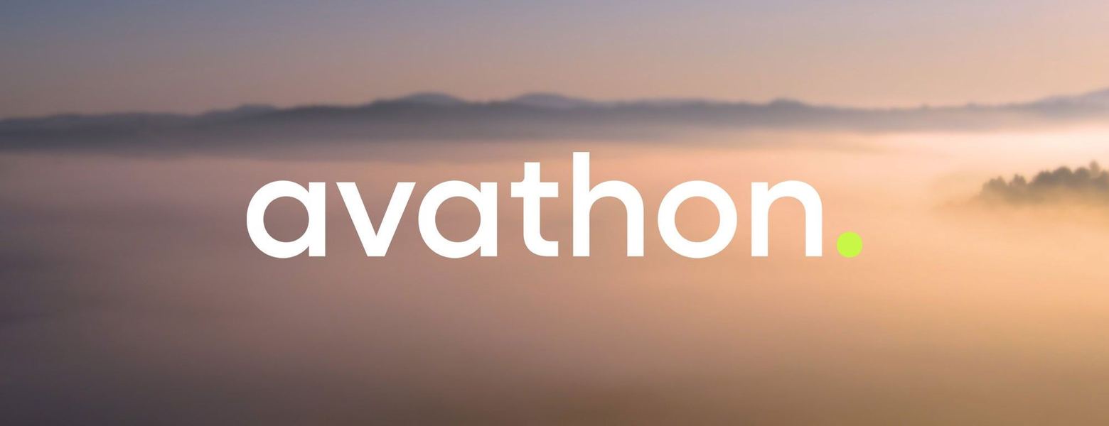 The Avathon wordmark over a mist-covered landscape at dawn