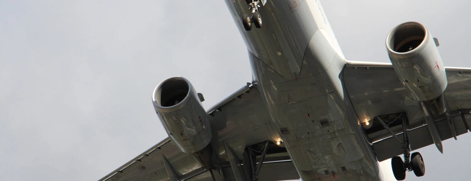 An airliner seen from below on final approach