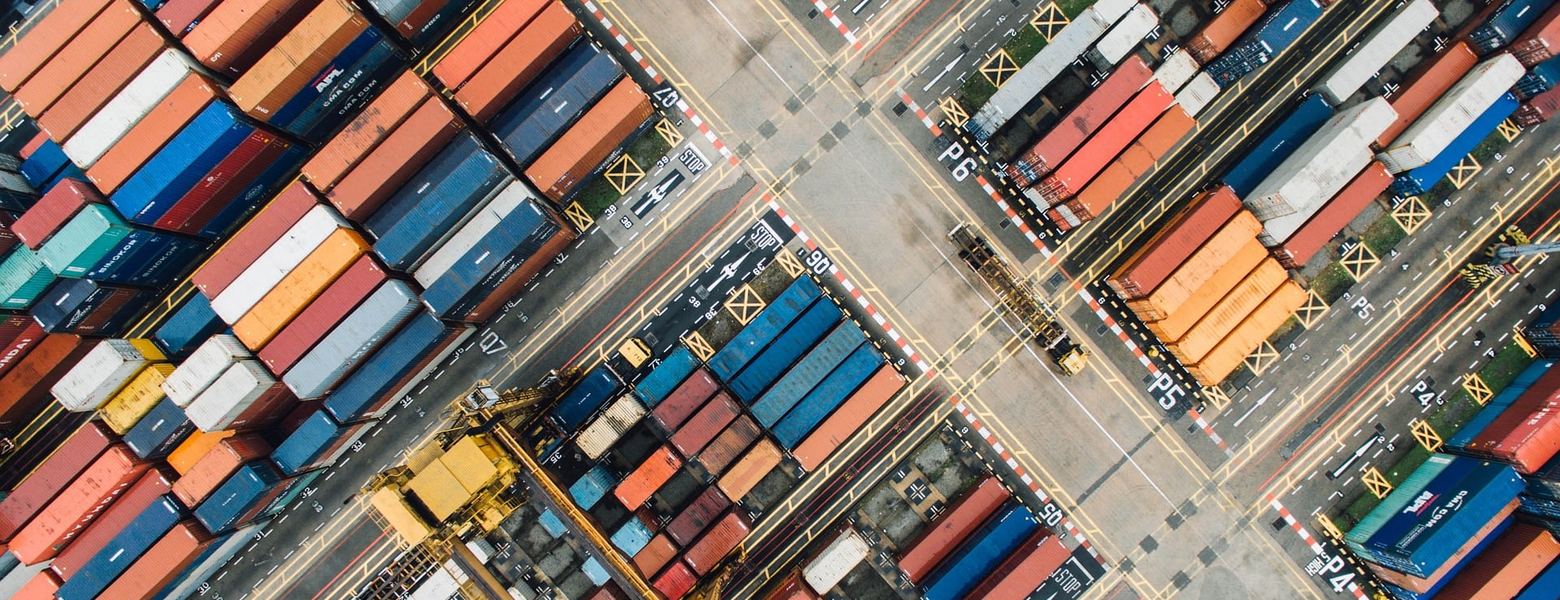 An aerial view of intermodal containers stacked in a yard