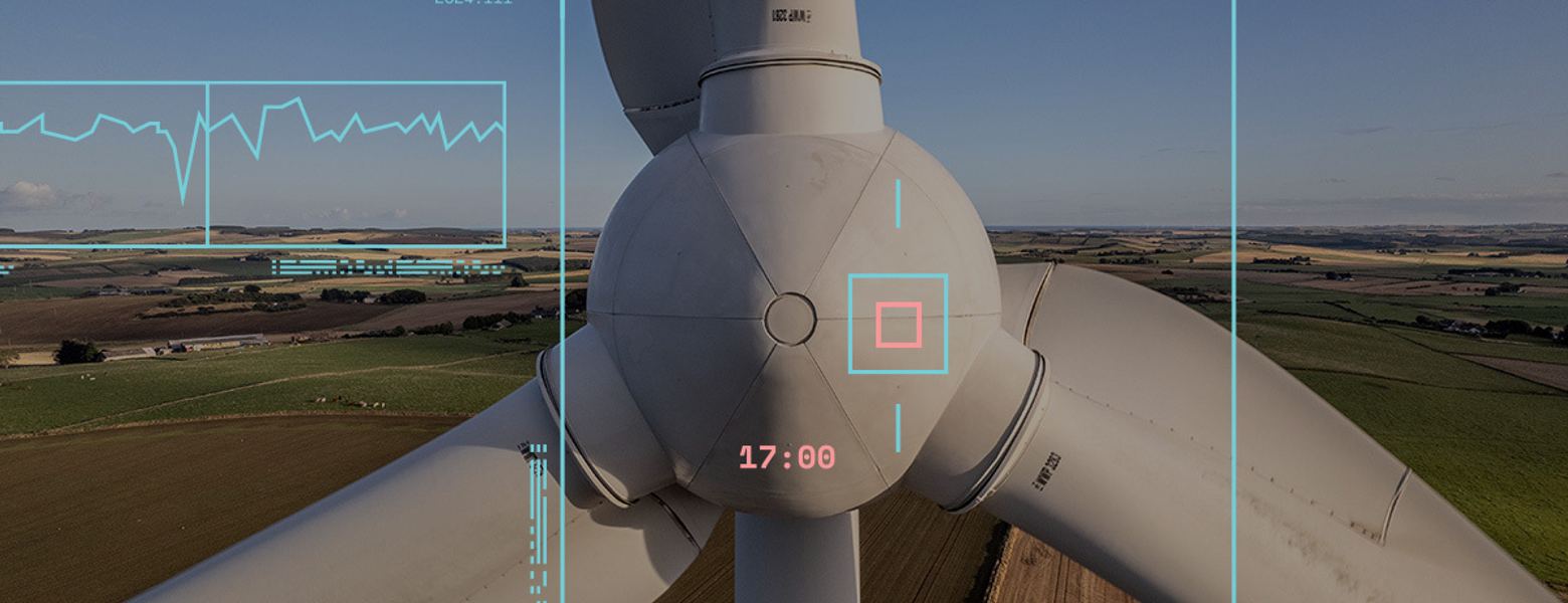 A wind turbine seen through an analytics overlay of tracking boxes and readouts