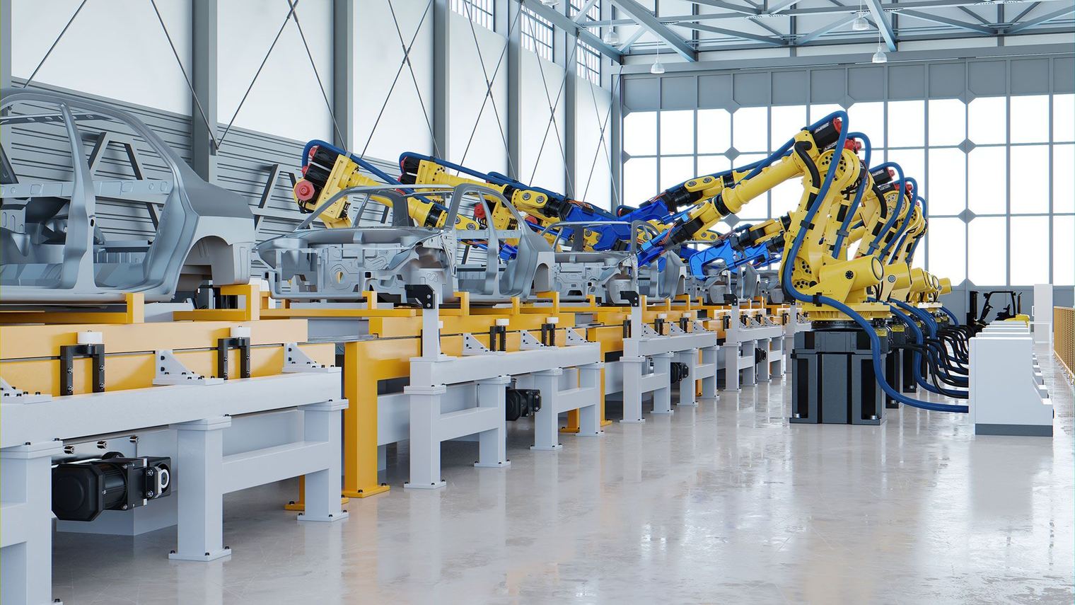 Factory hall with rows of robotic arms along an automated assembly line