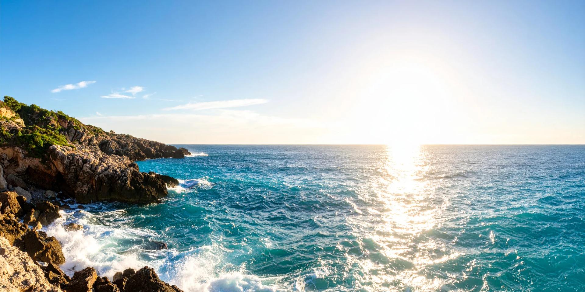 Dramatic coastal cliffs with turquoise water and rocky formations