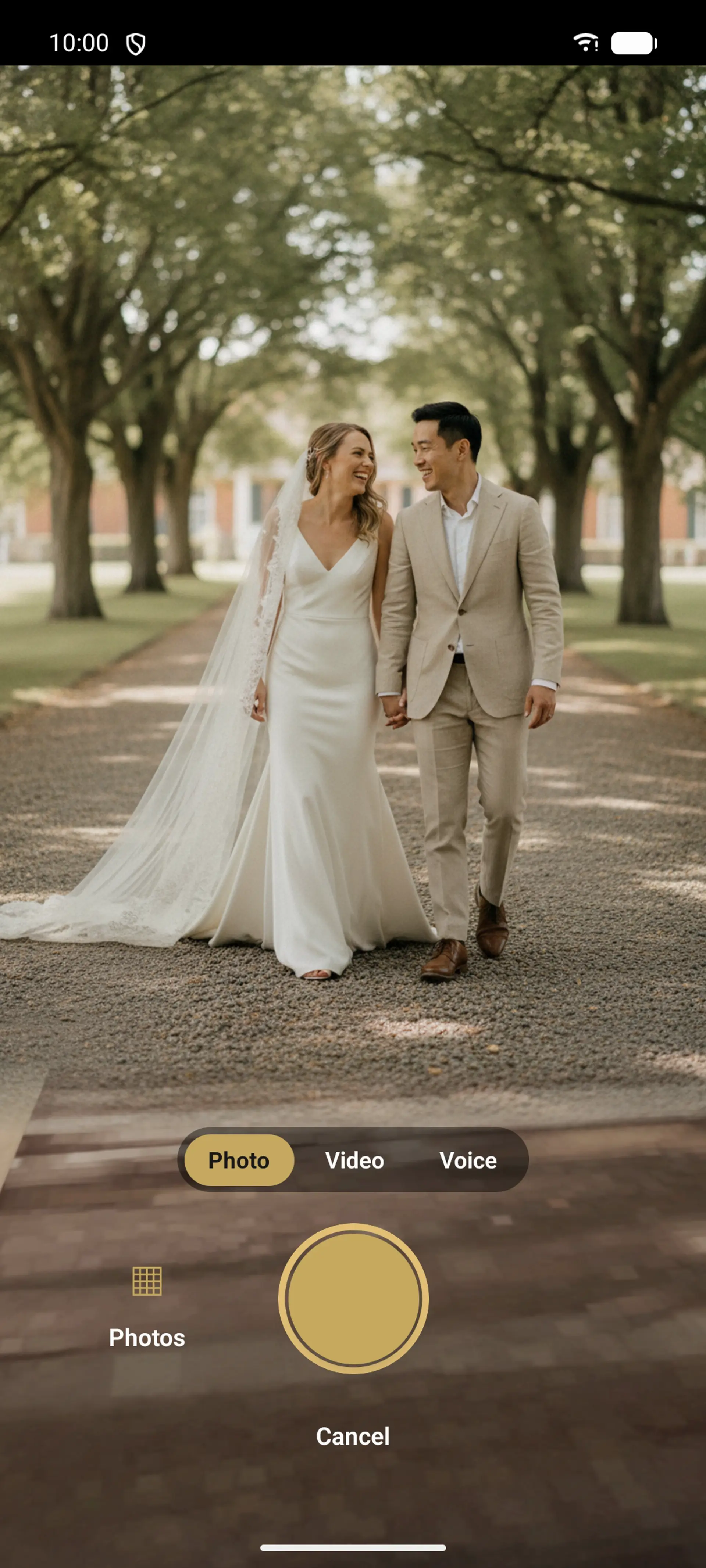 The Fizz companion app camera framing a just-married couple, with photo, video and voice modes
