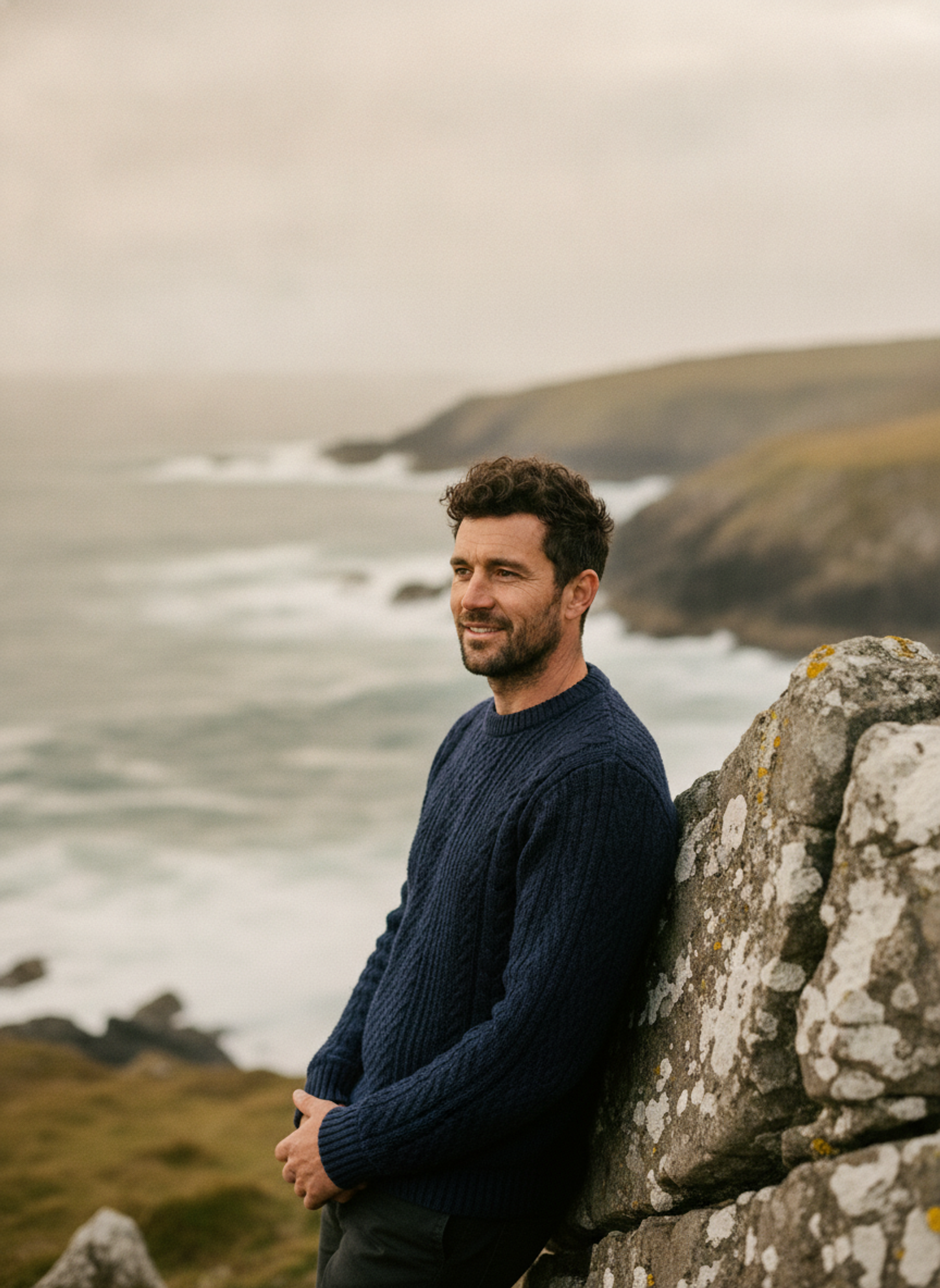 Finn on an Irish coast, waves breaking behind him