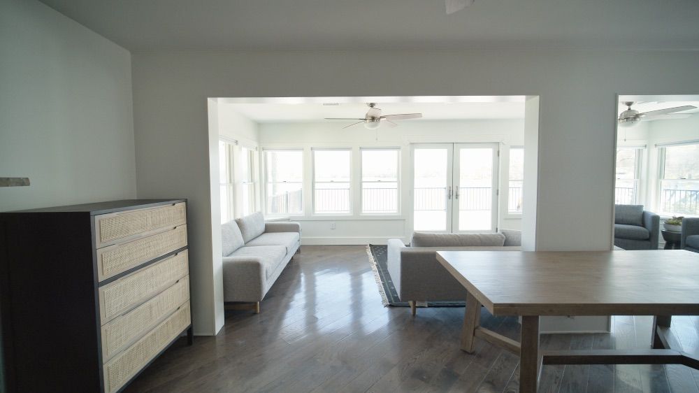 Sightline from the kitchen through to the dining area and sunroom beyond