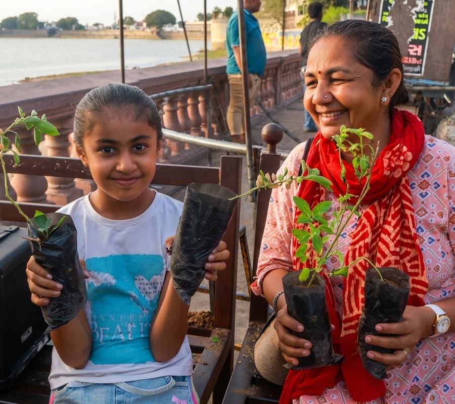 A mother and her daughter sit on a bench, smiling and holding saplings in their hands