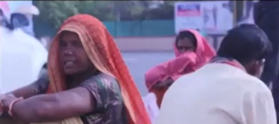 Two women and one men sitting 