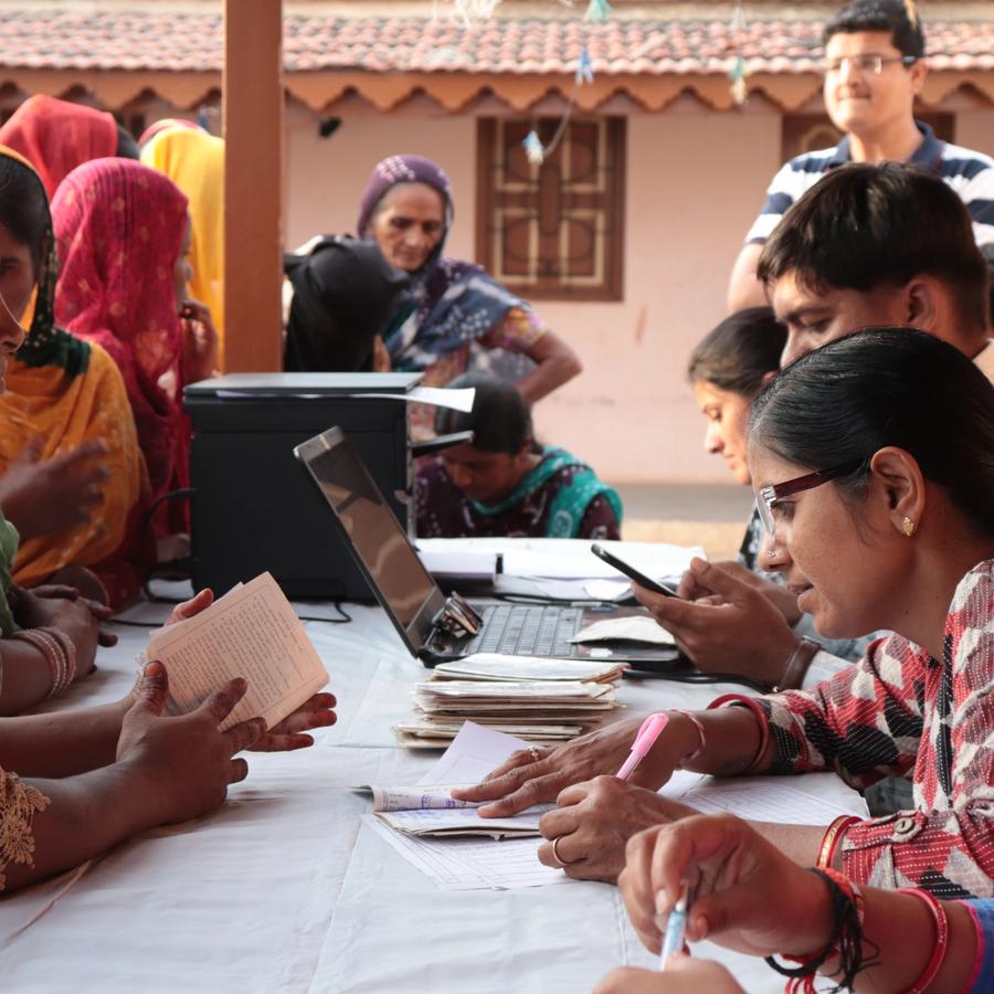 Staff addressing queries of public at a support desk