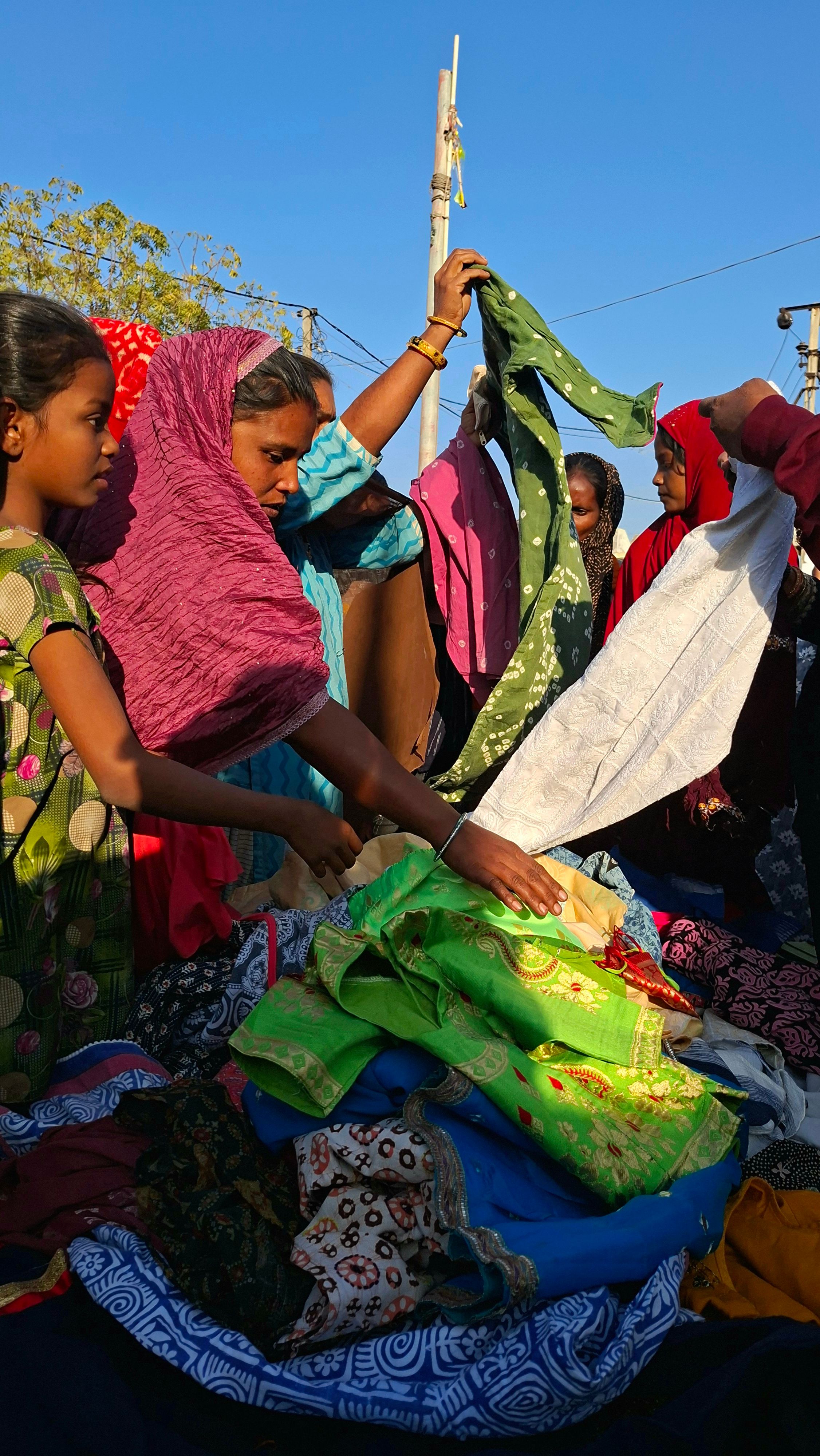 People checking clothes during the distribution drive