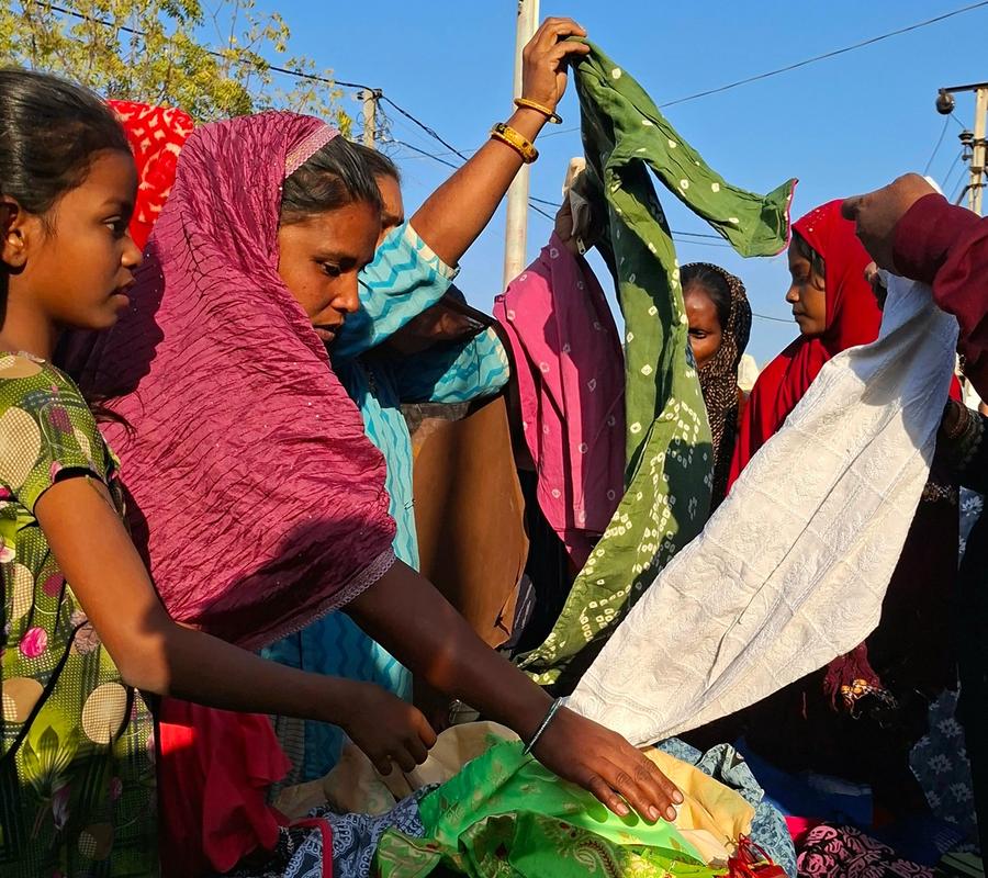 People checking clothes during the distribution drive