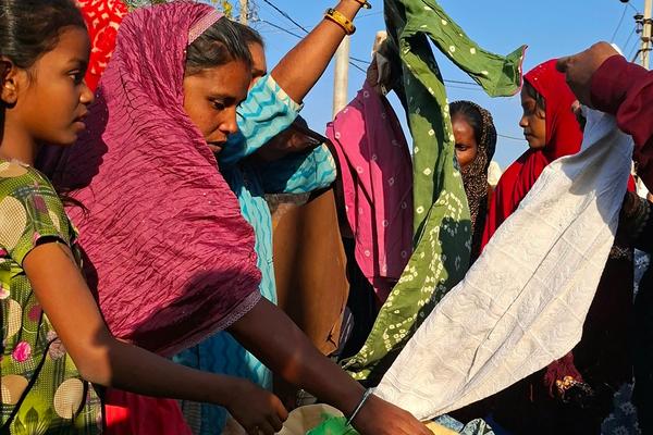 People checking clothes during the distribution drive