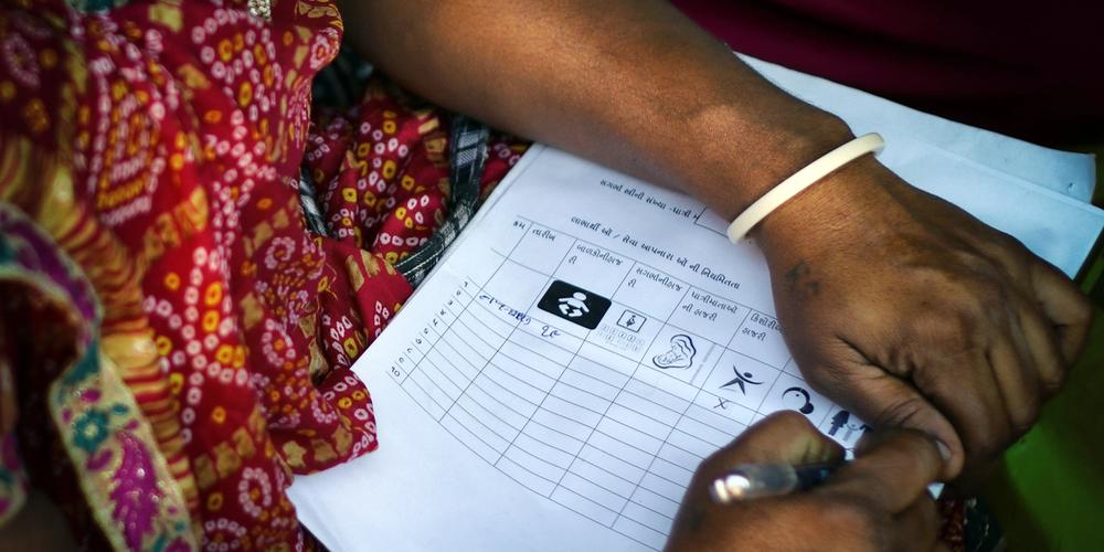 close up of a user-friendly design form being filled by a woman