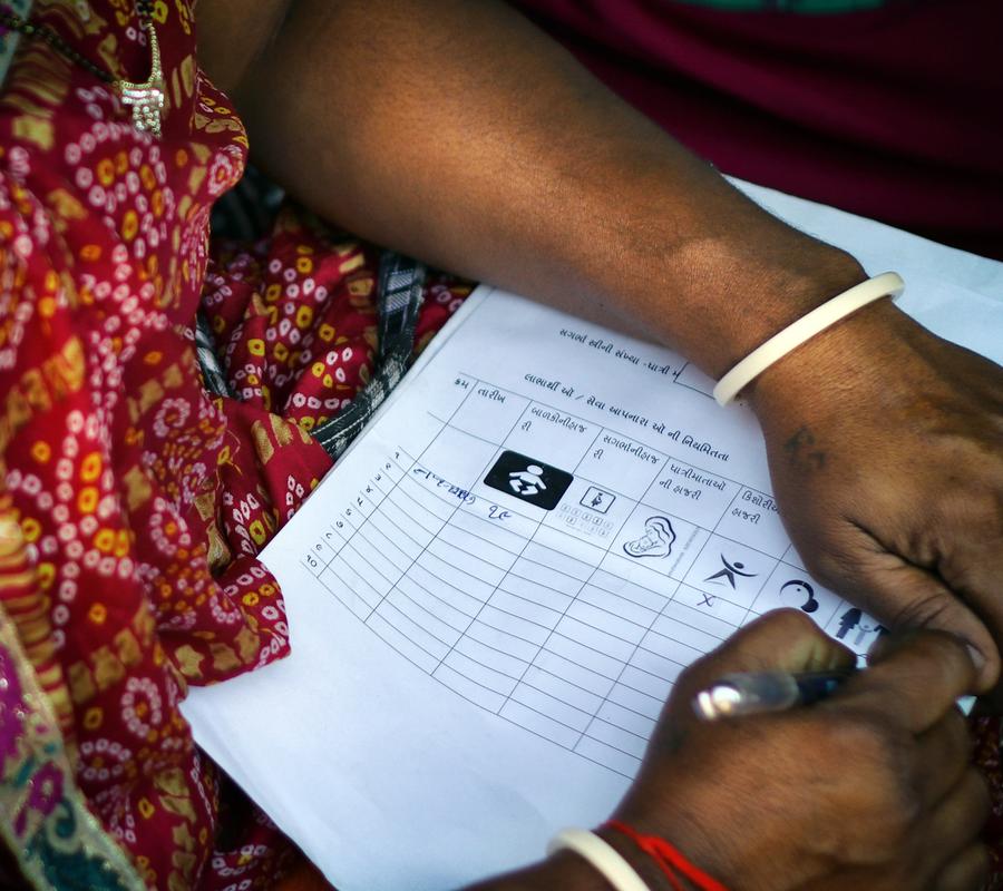 close up of a user-friendly design form being filled by a woman