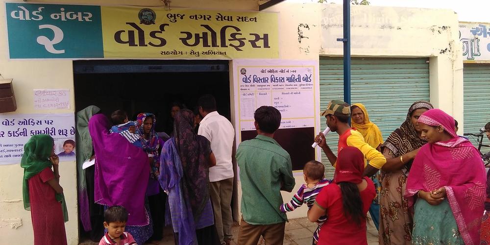 People gathered outside ward office number 2 with Gujarati-language signage.