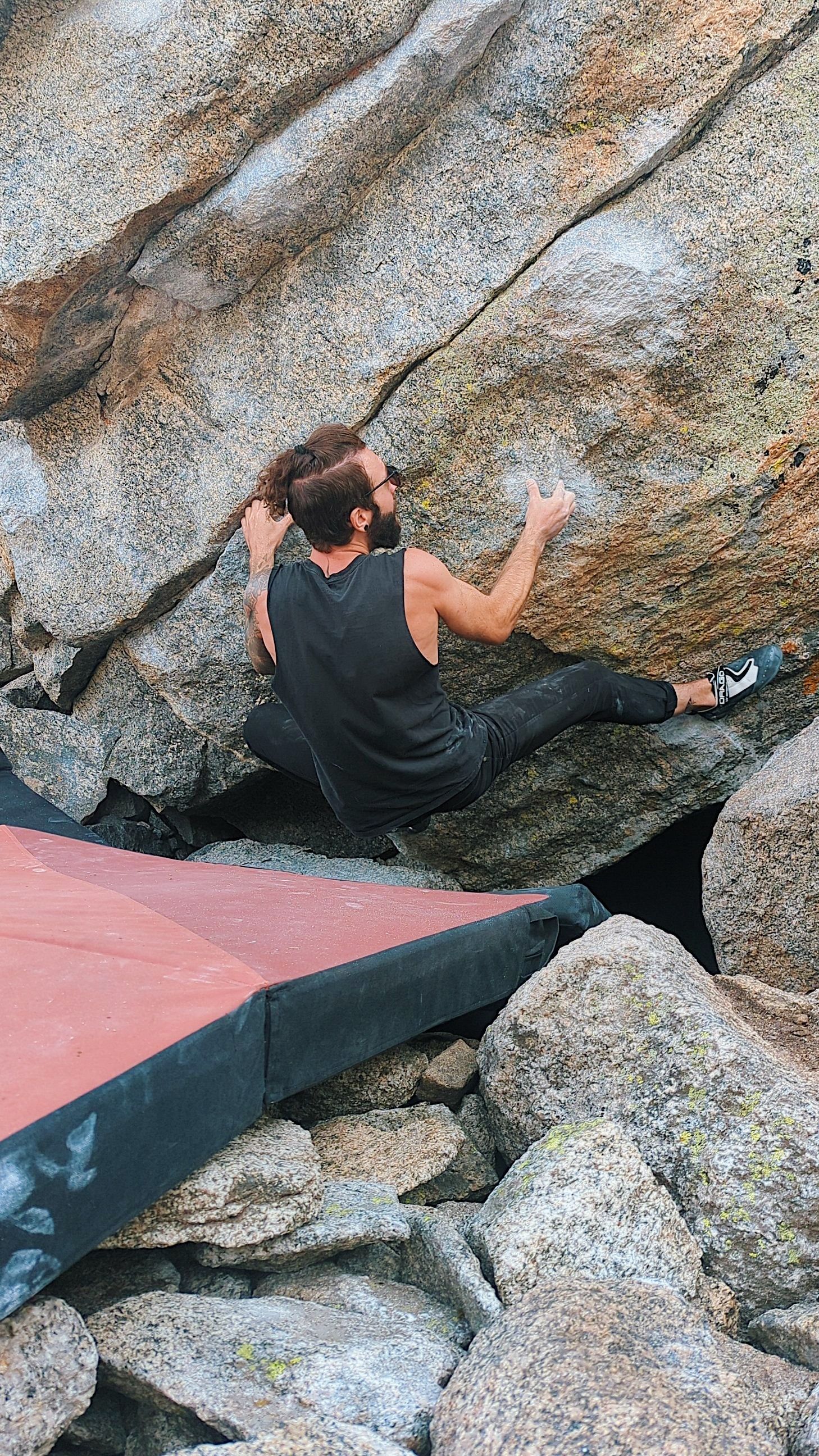 Nick wrestling some rocks at Lincoln Lake in August 2022