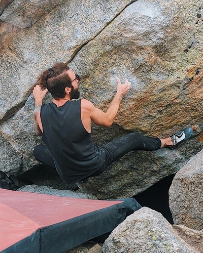 Nick wrestling some rocks at Lincoln Lake in August 2022