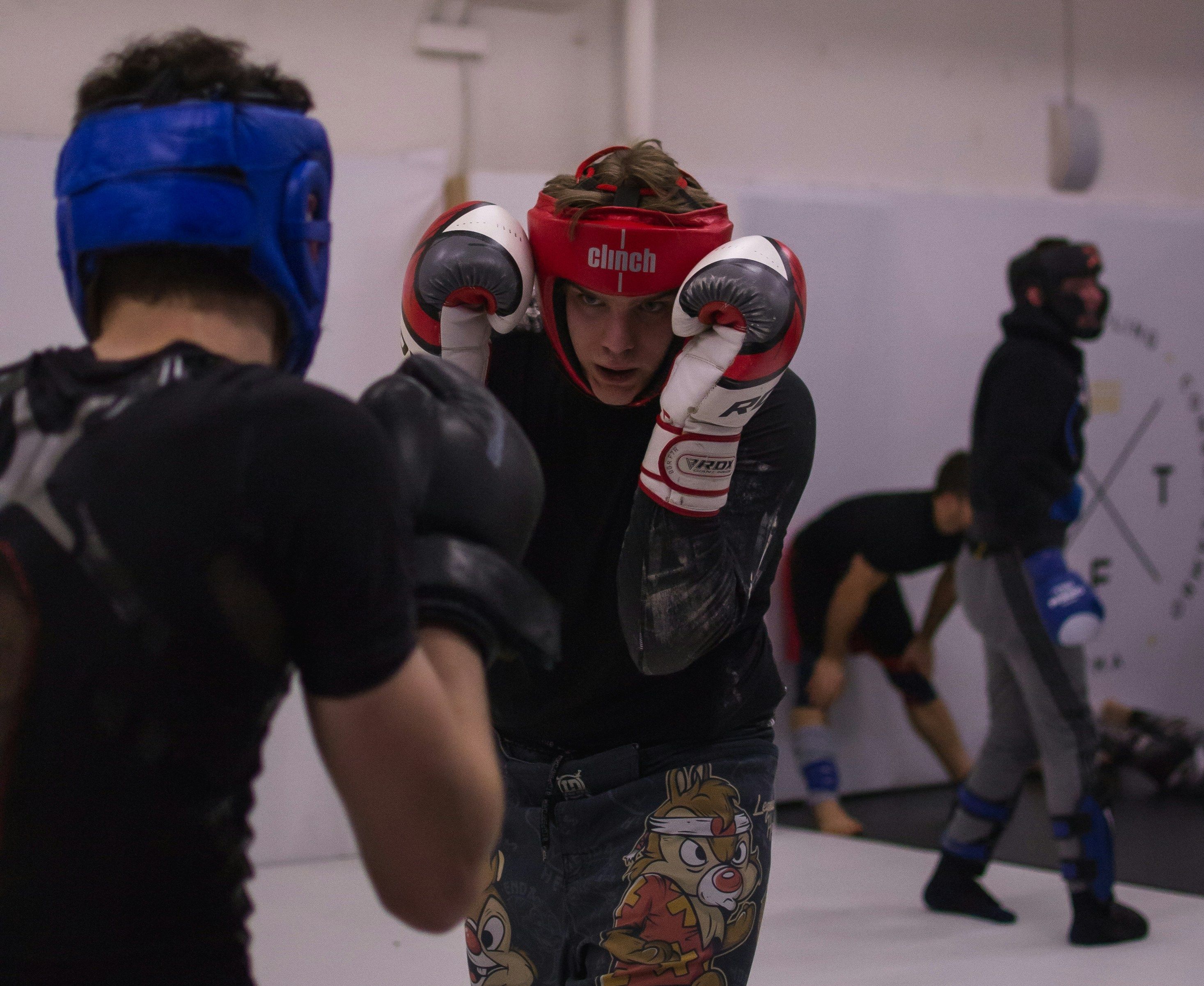 Two people sparring at D&A boxing gym