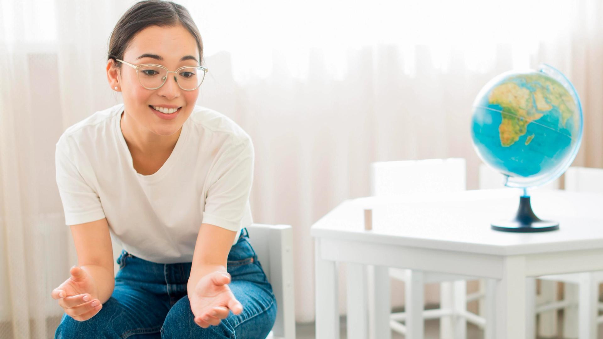 Sec 4 student studying O-Level Geography Physical and Human topics at desk with notes